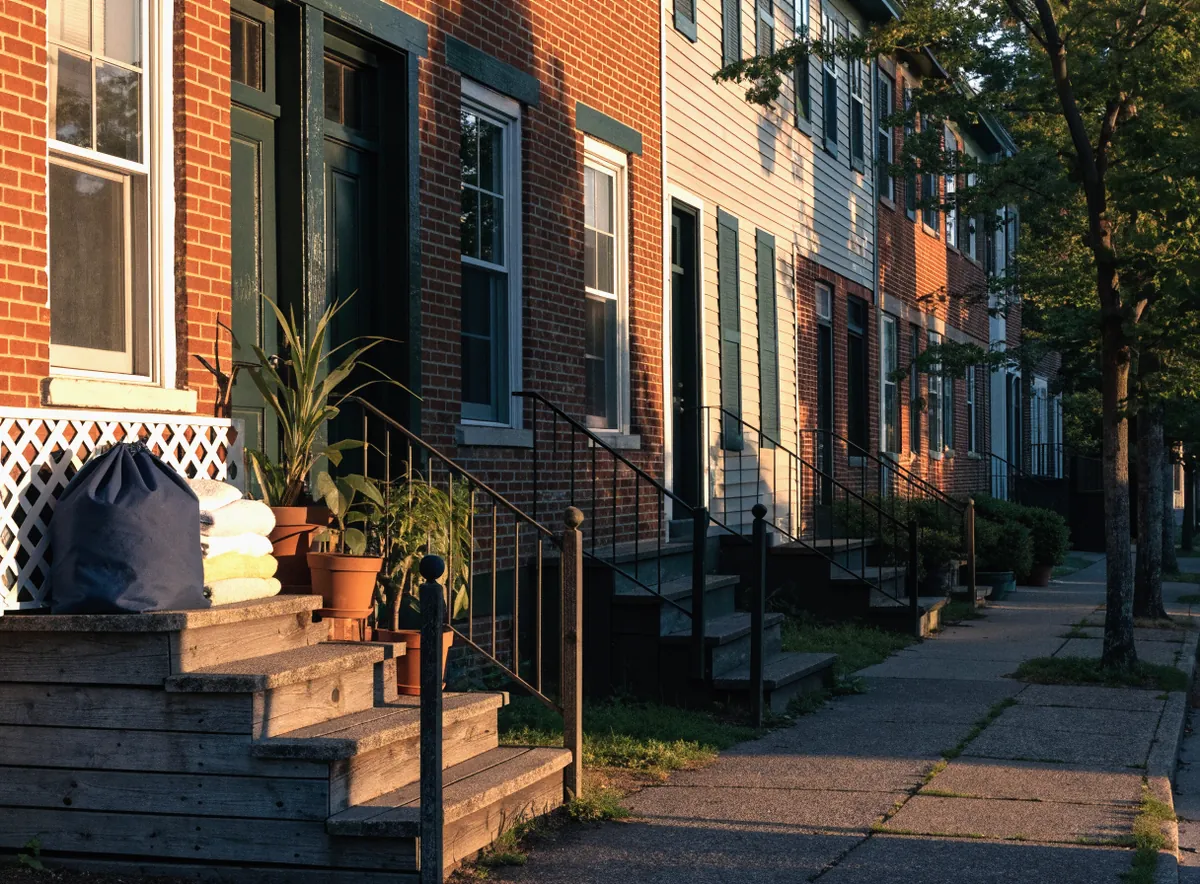 A laundry bag and folded towels on a townhouse stoop in South Bound Brook, NJ, ready for pickup